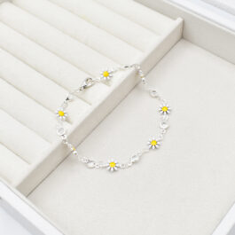 PULSERA DE ACERO BLANCO MARGARITAS CHICAS Y STRAS