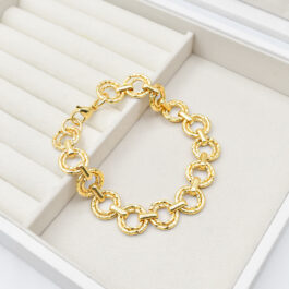 PULSERA DE ACERO DORADO DOBLE CIRCULO FACETADO