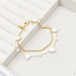 PULSERA DE ACERO DORADO DOBLE C/OSTRAS Y BOLITAS DE PERLA