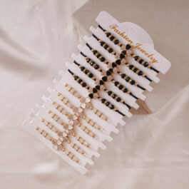 PULSERA DE MACRAME CON DIJE DE TREBOL BLANCAS Y NEGRAS X12