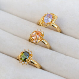 ANILLO DE ACERO DORADO C/CRISTAL Y STRASS X3