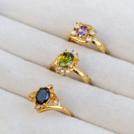 ANILLO DE ACERO DORADO C/CRISTAL Y STRASS X3