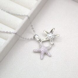 COLLAR DE ACERO C/DIJE ESTRELLA DE MAR MICROPAVE Y PERLA