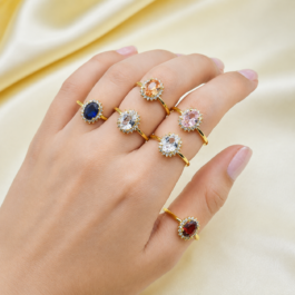 ANILLO DORADO TIPO GIRASOL C/CUBIC EN MEDIO X6