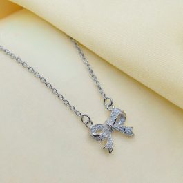 COLLAR DE PLATA RODINADA MOÑO C/ZIRCON