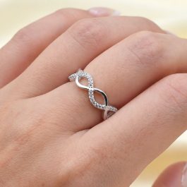 ANILLO DE PLATA TRENZADO TIPO INFINITO LISO C/ZIRCON CALADO