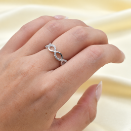 ANILLO DE PLATA TRENZADO TIPO INFINITO LISO C/ZIRCON CALADO