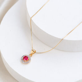 DIJE BAÑO DE  ORO 18K CIRCULO C/PIEDRA TIPO RUBI C/ZIRCON