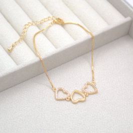 PULSERA BAÑO EN ORO 14K 2 CORAZONES ZIRCON Y 1 LISO CALADOS