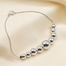 PULSERA LAMINADA EN PLATA 9 BOLONES C/ESLABON RIGIDO