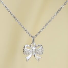 DIJES DE PLATA MOÑO CON PIEDRAS STRASS