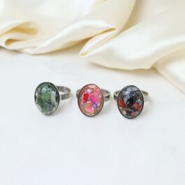 ANILLOS DE ACERO OVALADO C/RESINA Y PEDACITOS DE NACAR X3